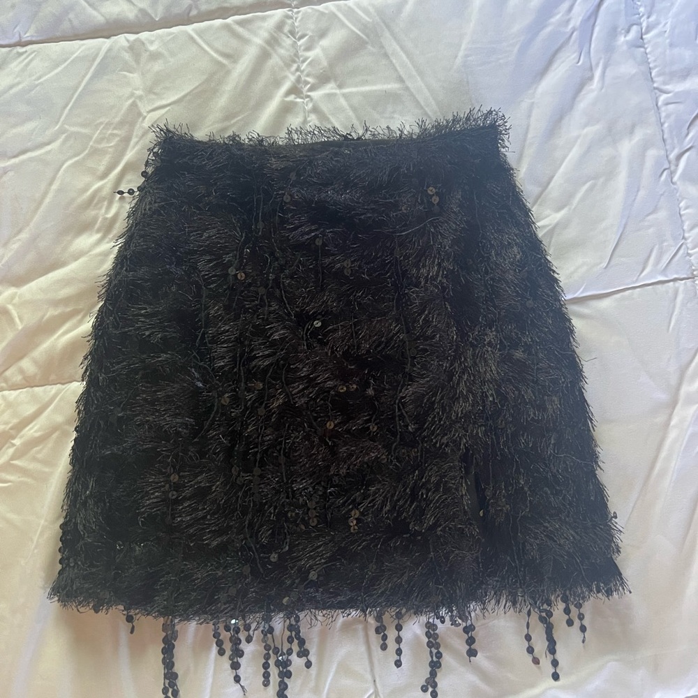 black mini skirt with fringe